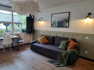 a living room with a couch and a table at Pirat Turawa in Turawa