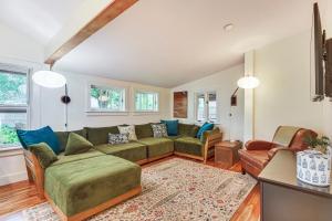 a living room with a green couch and chairs at Burlington Escape By Lake Champlain and Bike Path in Starr Farm Beach