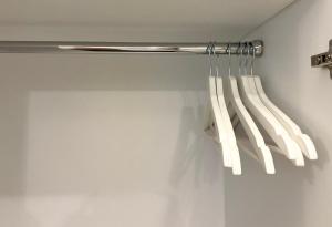 a bunch of white knives hanging from a rack at San Siro House in Milan +46 photos