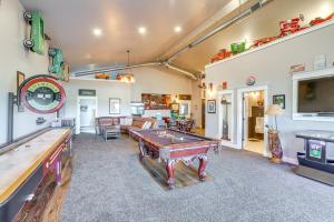 a living room with a pool table and ping pong tables at Private Hot Tub and Game Room Keenesburg Getaway! in Hudson