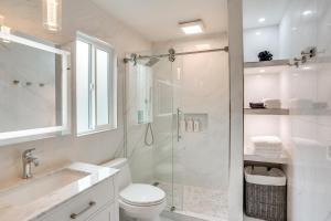 a bathroom with a shower and a toilet and a sink at 12 Mi to Disneyland! Sleek Suburban Home in Panorama Heights +28 photos