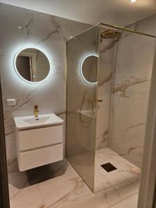 a bathroom with a sink and a shower at Luxury apartment in Stavanger in Stavanger