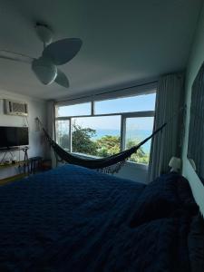 Ένα ή περισσότερα κρεβάτια σε δωμάτιο στο Zepp Casa - Vista do Mar