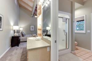 a bathroom with a sink and a toilet in a room at Sleeps 30, Riverfront, HotTub, PoolTable, DiscGolf in Three Rivers +55 photos