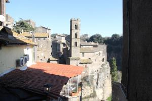 a view of a city with a clock tower at Biker house in Ronciglione