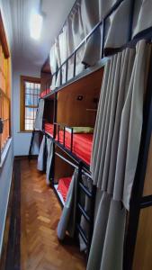 a group of bunk beds in a room at Hostel Casarão 65 in Salvador
