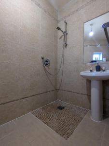 a bathroom with a shower and a sink at City Centre A Apartment, 2nd Floor in Belfast