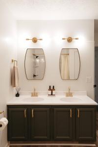 a bathroom with two sinks and two mirrors at "Morning View 1" Cozy Modern Stay - College/Hiking in Berea