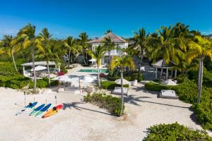 an aerial view of a resort with surfboards on the beach at 7 bedroom plantation estate Villa in Leeward