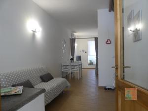 a living room with a couch and a table at Alloggio "a casa di Gió" in Tuscania +11 photos