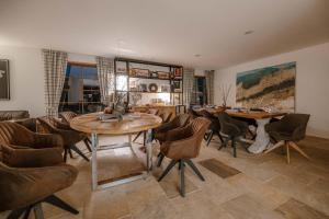 a dining room with a table and chairs at Vila Zvonica in Starý Smokovec