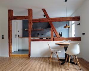 a dining room with a table and two chairs at Studio-Apartment in Eisenberg, Thüringen in Eisenberg