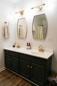 a bathroom with two sinks and two mirrors at "Morning View 3" Cozy Modern Stay - College/Hiking in Berea