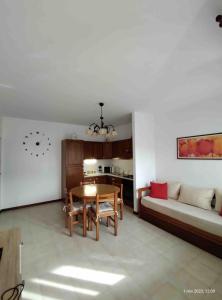 a living room with a table and a couch at Casa Nana' in Thiene