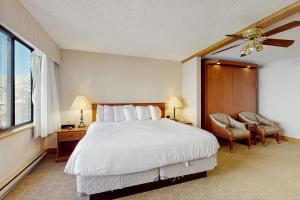 a bedroom with a large white bed and a window at GL306 Butte Gem in Crested Butte +47 photos