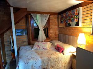 Postel nebo postele na pokoji v ubytování Casa de praia