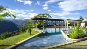 a swimming pool with a view of mountains at Saloya Mindo Life Landscape Hotel in Chigüipe