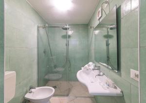 a bathroom with a shower and a sink and a toilet at O'Vascio Sant'Angelo in Serrara Fontana