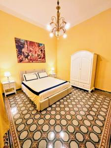 Ένα ή περισσότερα κρεβάτια σε δωμάτιο στο Leonardo House Pisa giardino piscina idromassaggio riscaldabile casa indipendente posizione centrale a pochi passi dalla stazione +25 φωτογραφίες