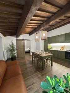 a kitchen and dining room with a table and chairs at Under The Tuscan Sun in Arezzo