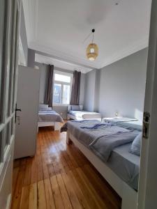 a bedroom with two beds and a window at Cairo Backpacker Central Hostel in Cairo