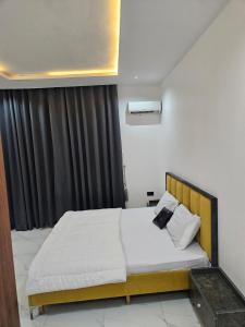 Postel nebo postele na pokoji v ubytování Diamond Flux Apartments