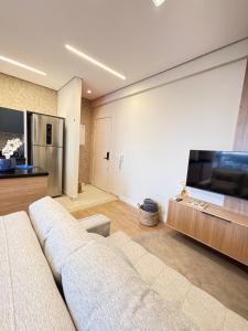 Μια τηλεόραση ή/και κέντρο ψυχαγωγίας στο Uno Loft em Mogi das Cruzes