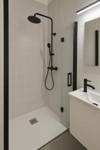 a bathroom with a shower and a sink at Uíma River House  +12 photos