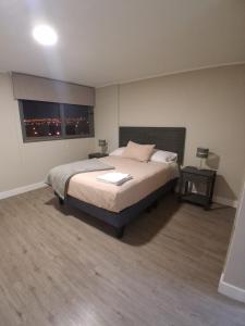 Ένα ή περισσότερα κρεβάτια σε δωμάτιο στο Ed 1 New Apartment Coquimbo