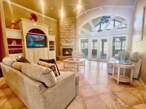a living room with a couch and a fireplace at Casa Oasis Extra Large home centrally located in Johnson