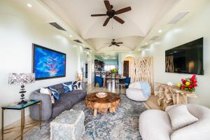 a living room with a couch and a table at Oceanview In Town Huge Pool Beach Acss in Tamarindo