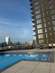 a swimming pool on the roof of a building at Griffintown luxury 1 open bedroom apartment in Montréal