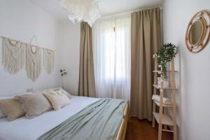 a bedroom with a bed and a mirror and a shelf at Bellavista Riva in Riva di Solto