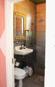 a bathroom with a sink and a toilet and a shower at Cozy Historic 1br Casa Mina Free Parking in El Paso +22 photos