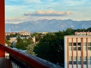 a view of a city with mountains in the background at CityStay Apartment Žilina with Parking in Žilina