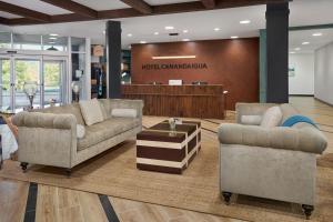 a lobby with two couches and a waiting room at Hotel Canandaigua, Tapestry Collection By Hilton in Canandaigua