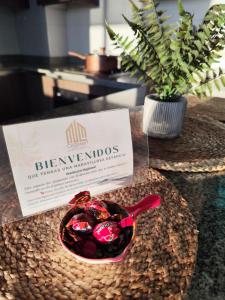 a bowl of candy on a table with a plant at 707,Vista espectacular in Valparaíso