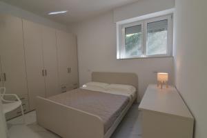 Ένα ή περισσότερα κρεβάτια σε δωμάτιο στο Central Apartment