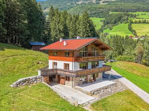 an aerial view of a house on a hill at Haus Bergstille Top 1 in Vorderkrimml