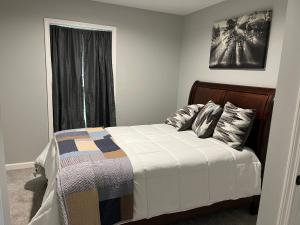 a bedroom with a bed and a window at Moosehaven in Campton +9 photos