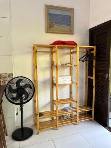 a room with a bunk bed and a fan at Chalé Suítes Casa na Praia de Itamambuca in Ubatuba