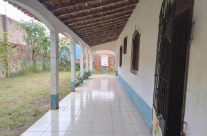 an empty hallway of a building with an archway at Aconchego Benevides in Benevides +4 photos