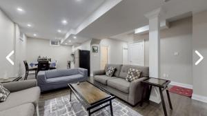 a living room with two couches and a table at Heaven on Earth in Ajax