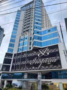 a large building with a sign in front of it at Inspiria Condo 1br beside Abreeza Mall, JP Laurel Street Bajada Davao City in Davao City