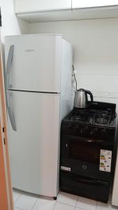 Una cocina o cocineta en Obelisco cityy 2 fotos más