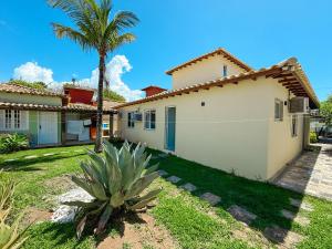 Casa Paraíso في بوزيوس: منزل أمامه نخلة