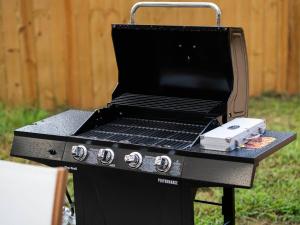 a grill with a black top on top of it at Fine Design | 14 Guest | Sauna | HotTub | Firepit in Southern Shops