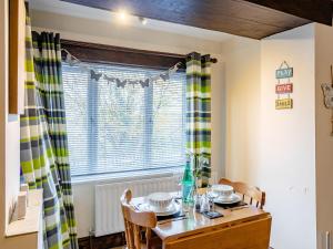 a dining room with a table and a window at The Miners Rest in Middleton