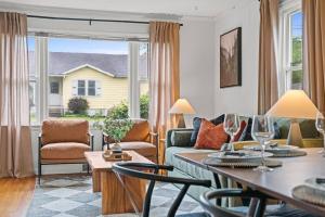 a living room with a couch and a table at 9mi To NRG | Game Room | Hot Tub | Firepit | Grill in Oak Hill