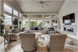 a living room with a couch and chairs at Oceanfront 7 BR 7 BA Wonderful Pool Deck Beach gear and bike rentals included in Hilton Head Island